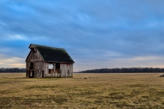 Old lone barn in a field after a storm | Image By Indiana Architectural Photographer Jason Humbracht